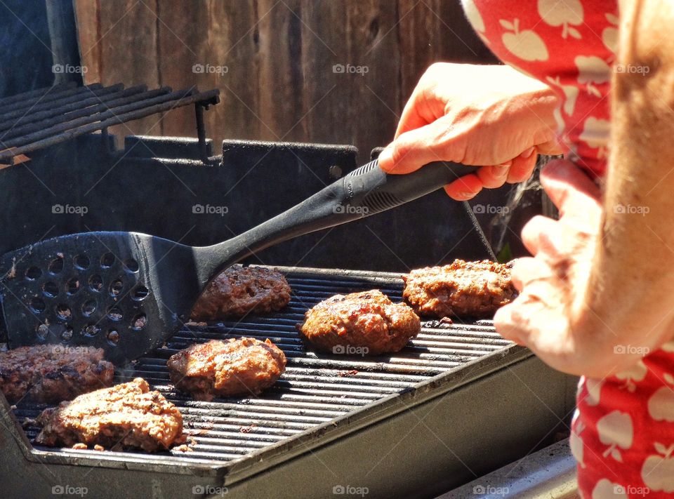 Mom Cooking Burgers On The BBQ