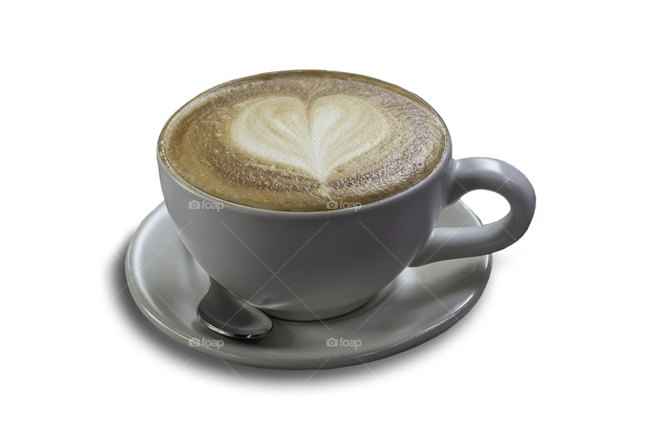 Hot coffee Espresso topped with a heart-shaped milk in white glass on a white background with clipping path.