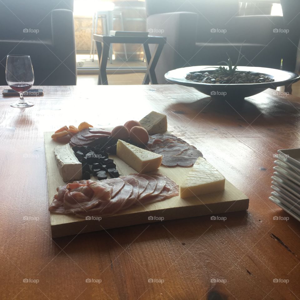Charcuterie platter at the vineyard in the afternoon. 