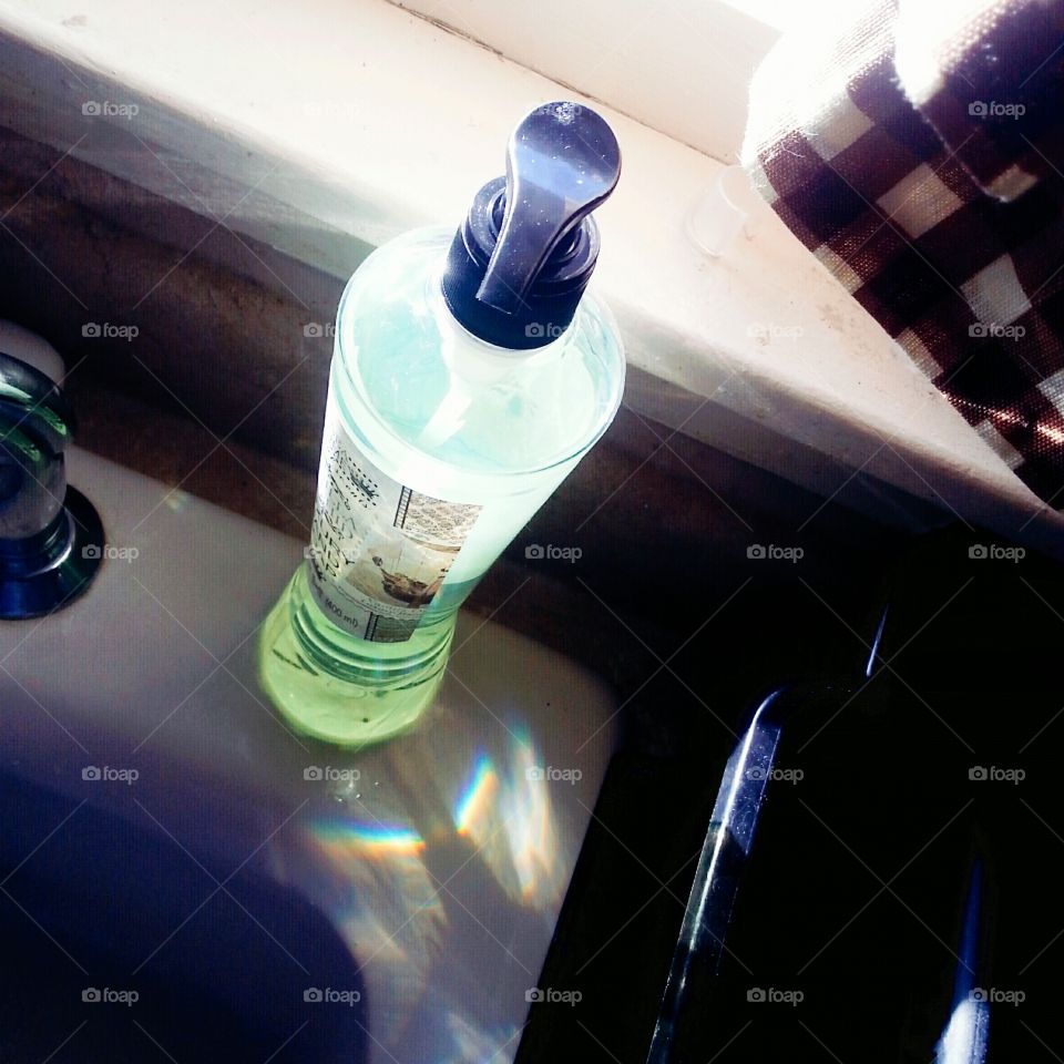 Sunlight through a soap dispenser