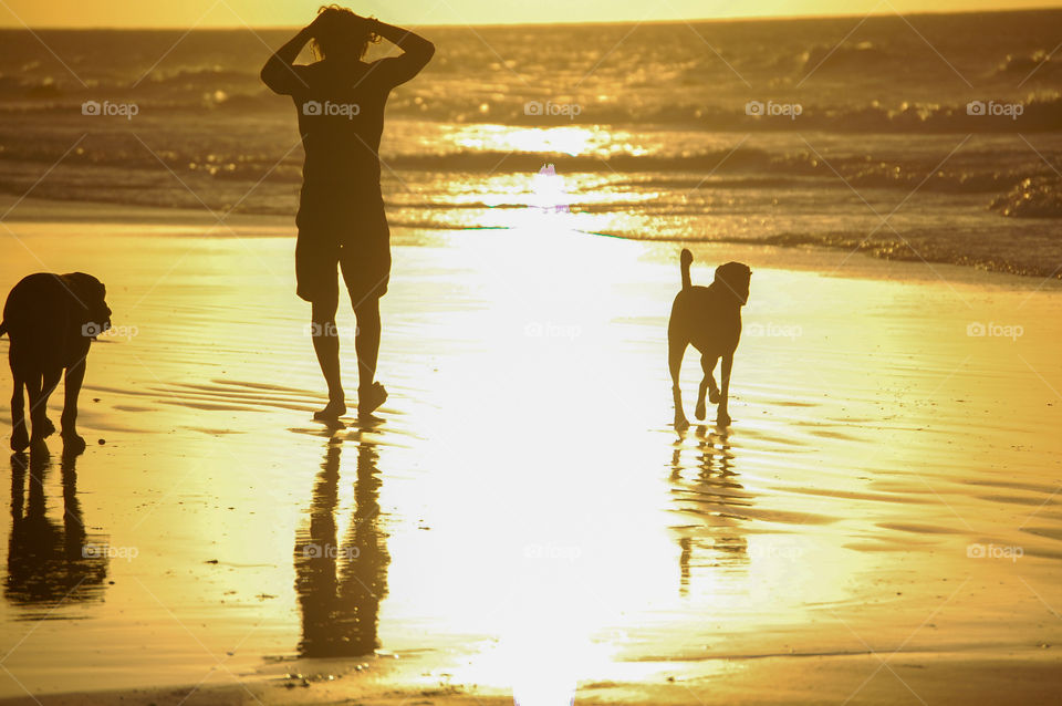 Woman and dog at golden hour. 