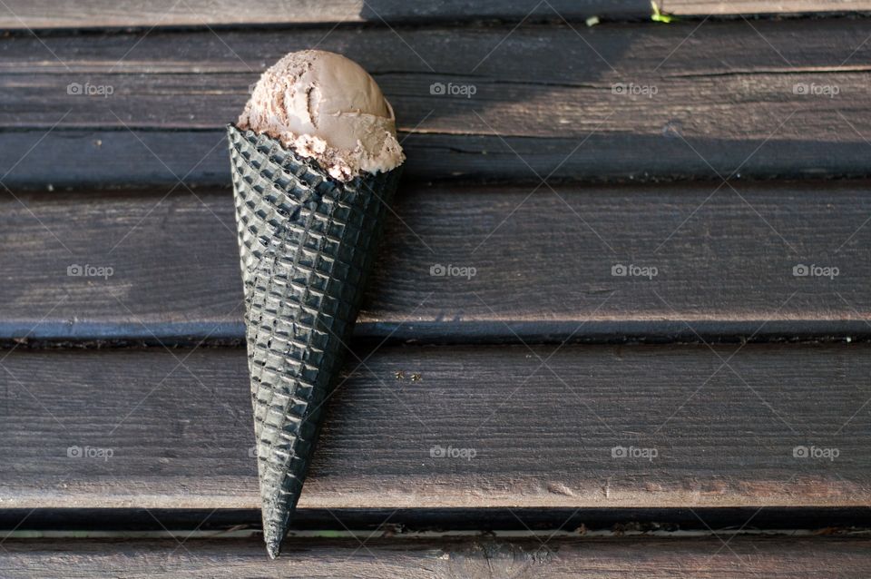 Chocolate ice cream on wood