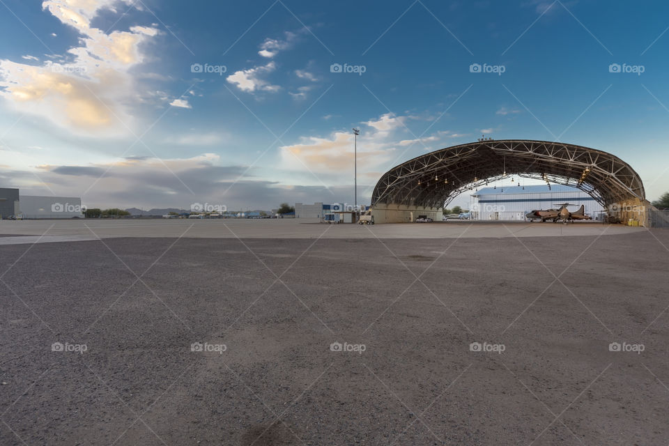 Vintage Airport Hangar Under Setting Sun