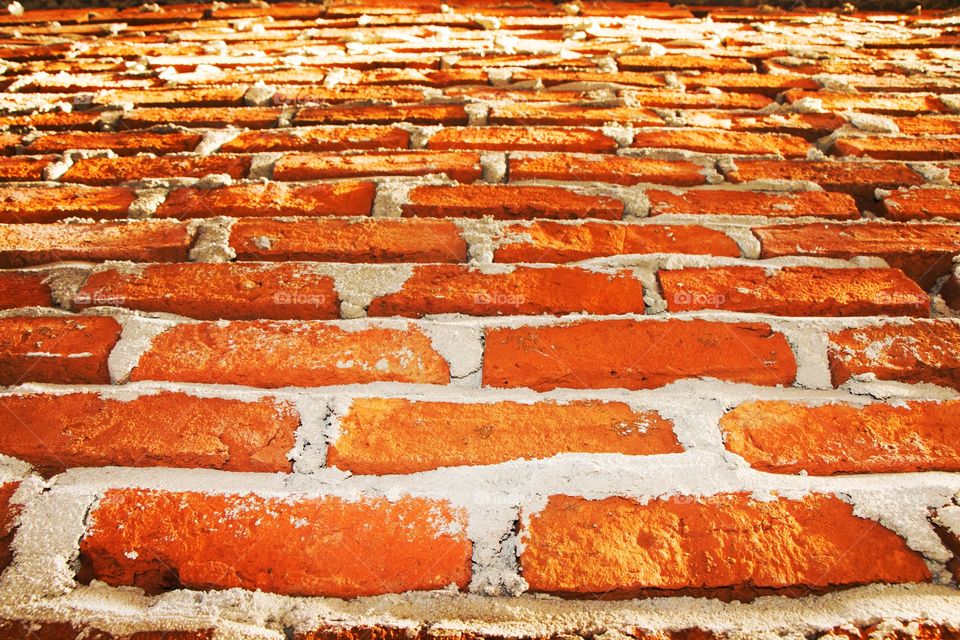 Closeup of weathered brick wall.