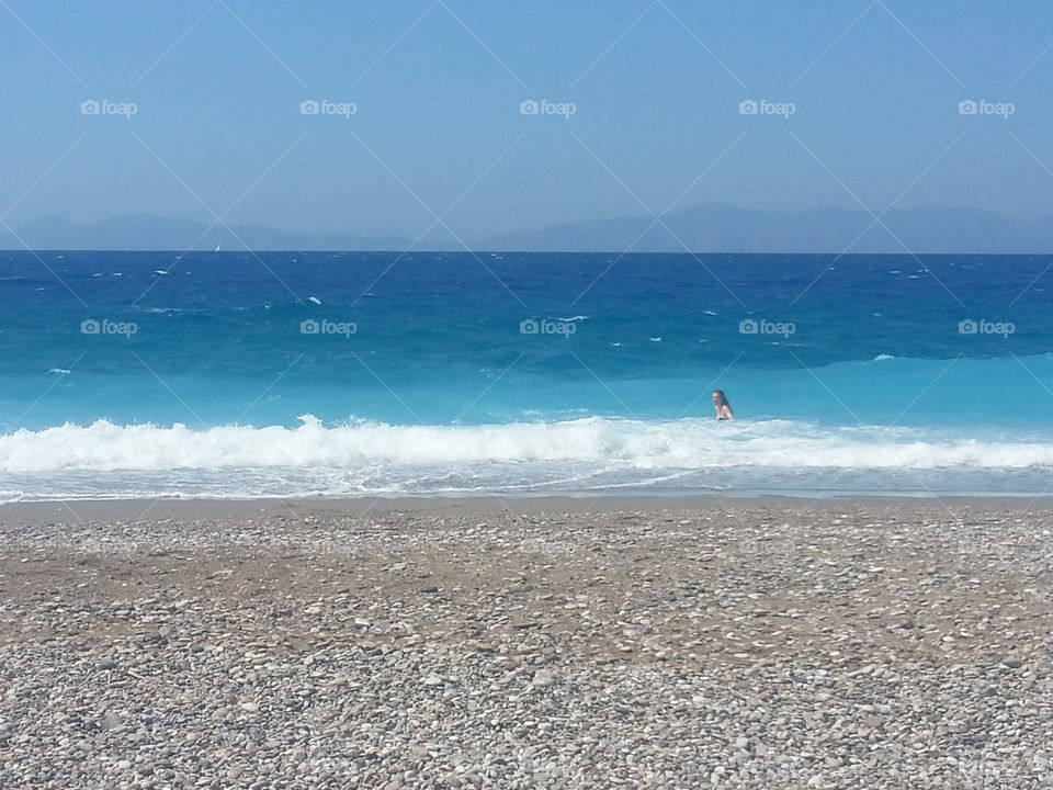 ginger in the water. my girlfriend coming out of the water