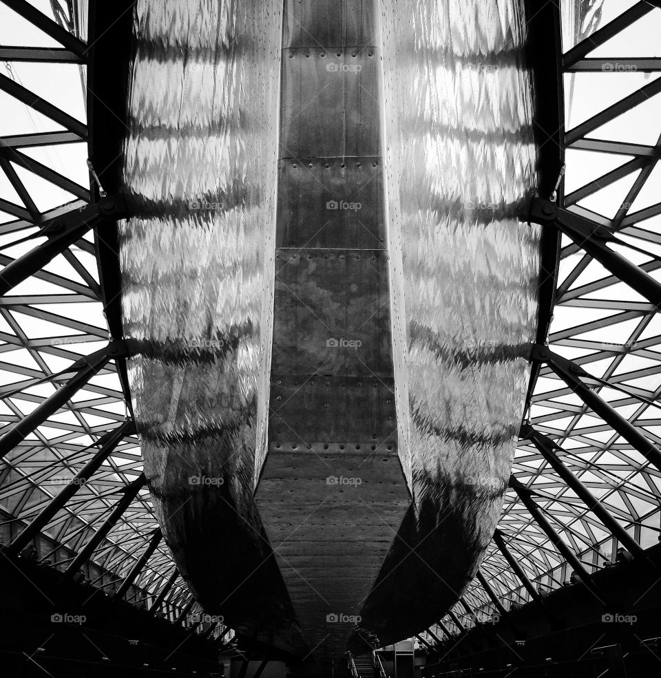 On an even keel. A view underneath the clipper Cutty Sark at Greenwich, London, England.