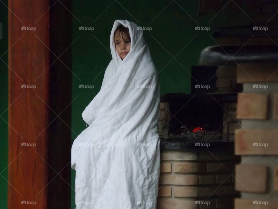Girl in the cold wrapped in blanket