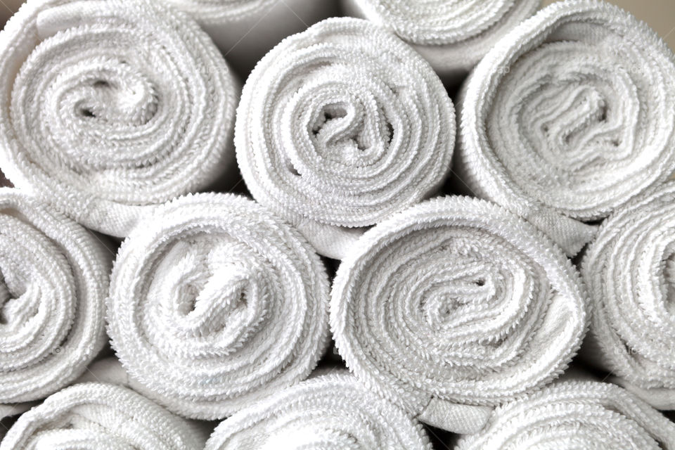 rolled white towels background. rolled white towels background in fitness yim