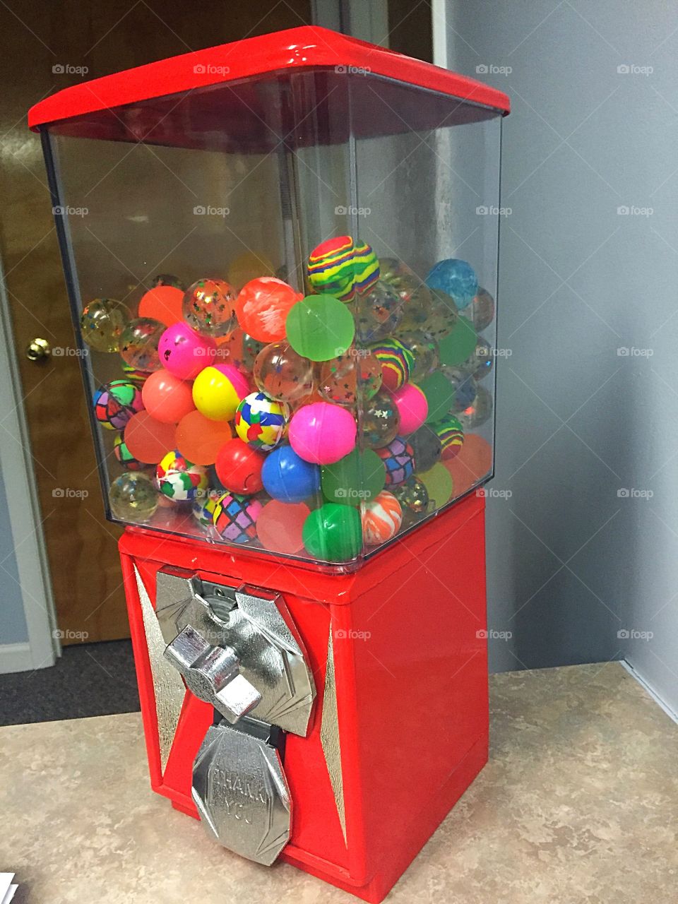 Gumball machine full of bouncy balls. 