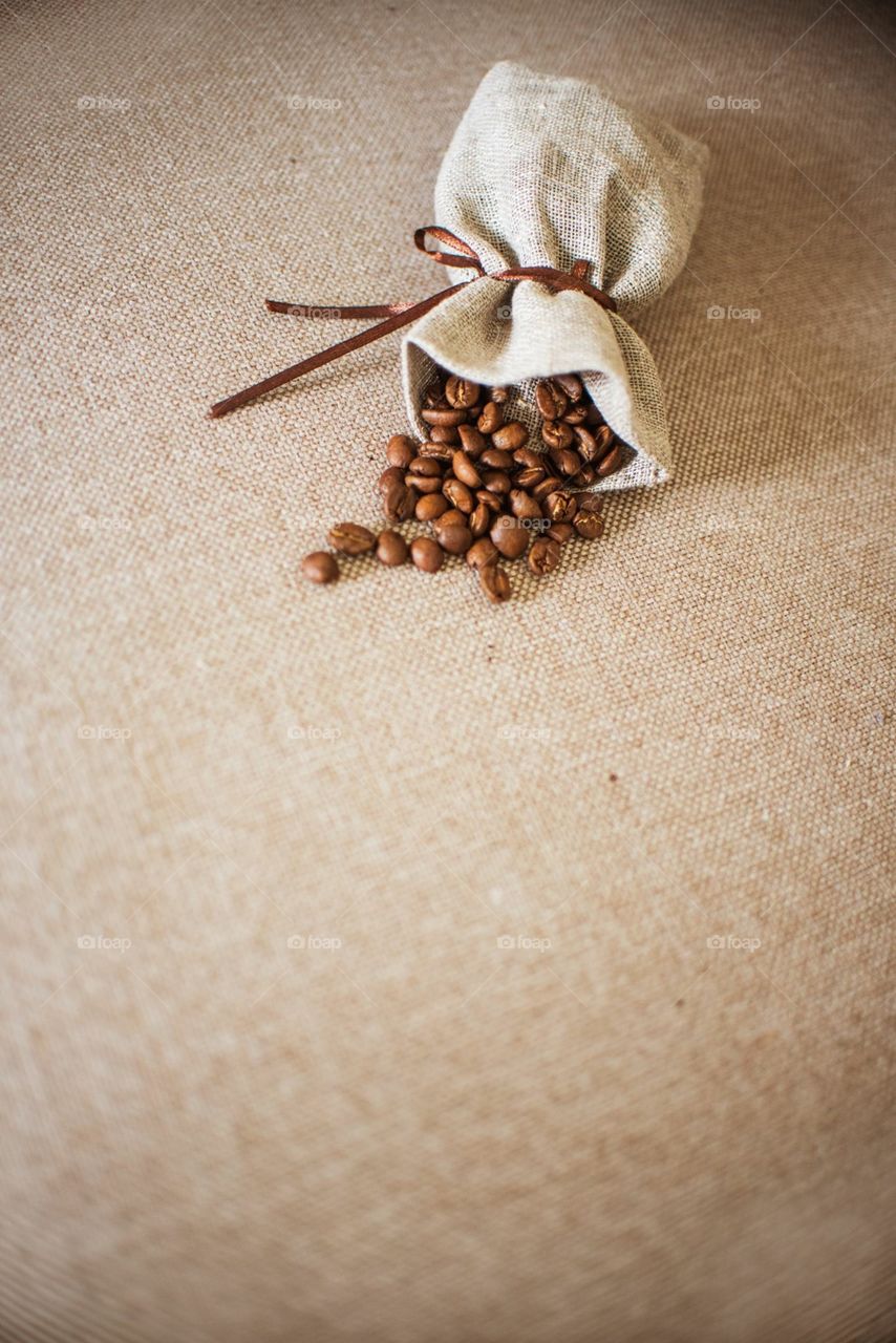 A Coffee Sack With Scattered Beans 