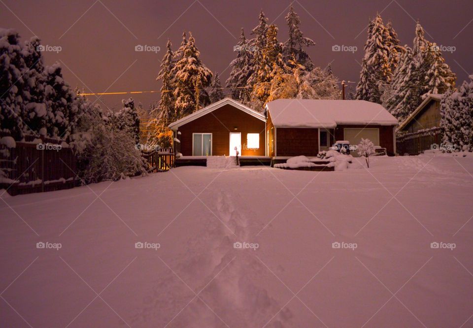 Cozy little house in the snow after a storm