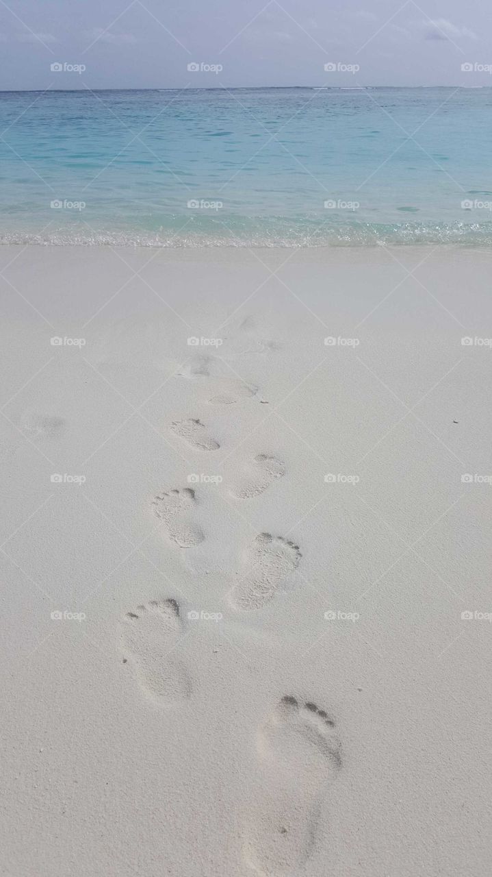 footprints on the beach