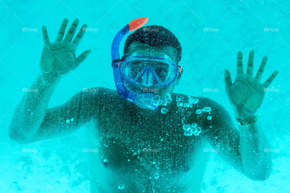The man under water in the mask. 