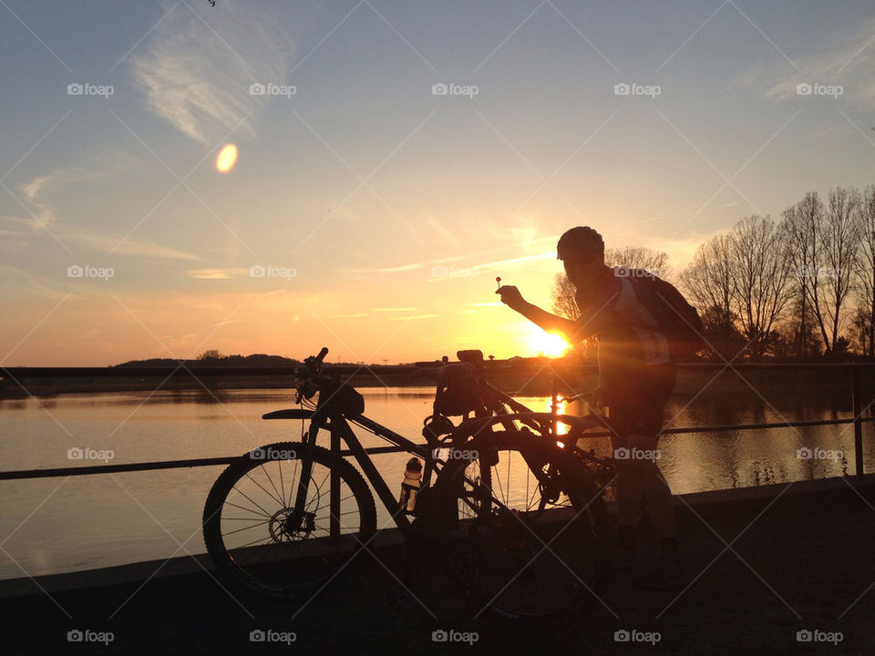 bike sea sunset sky