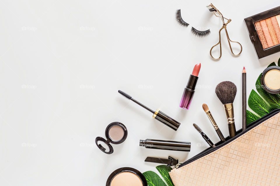 Flat lay of beauty products on white background 