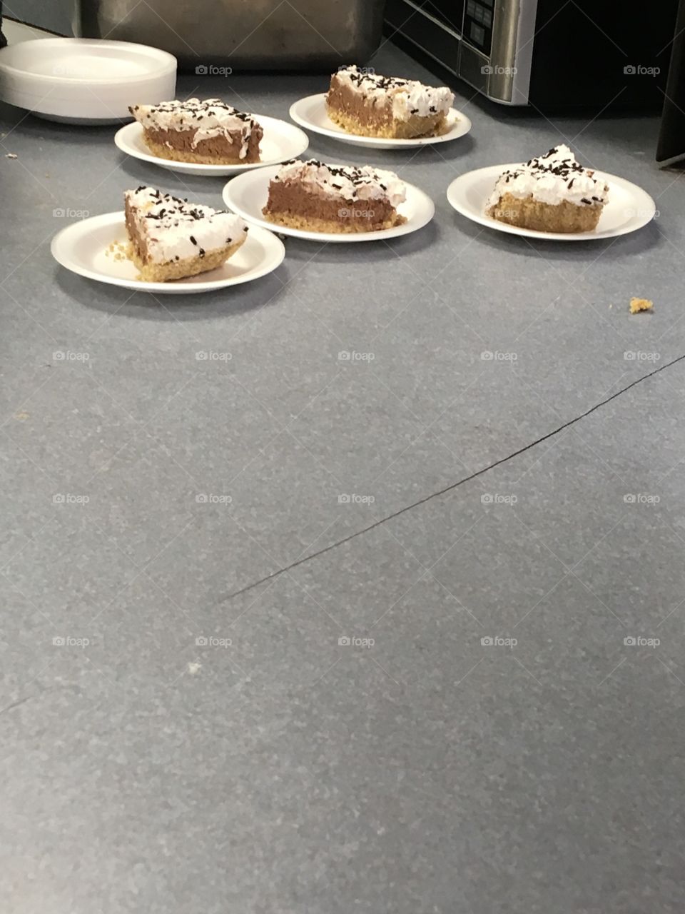 Rich chocolate cream pie slices! Serving desert before the dance. Yum yum for the yum rum