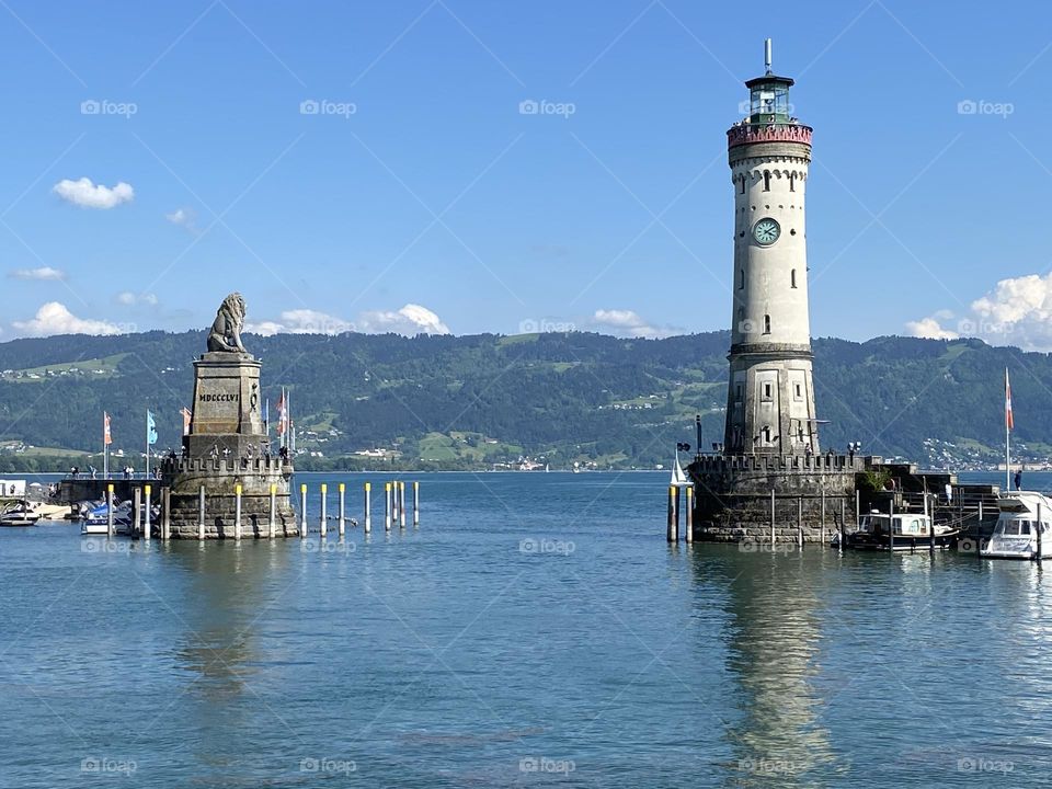Port entrance of Lindau with lighthouse and lion monument