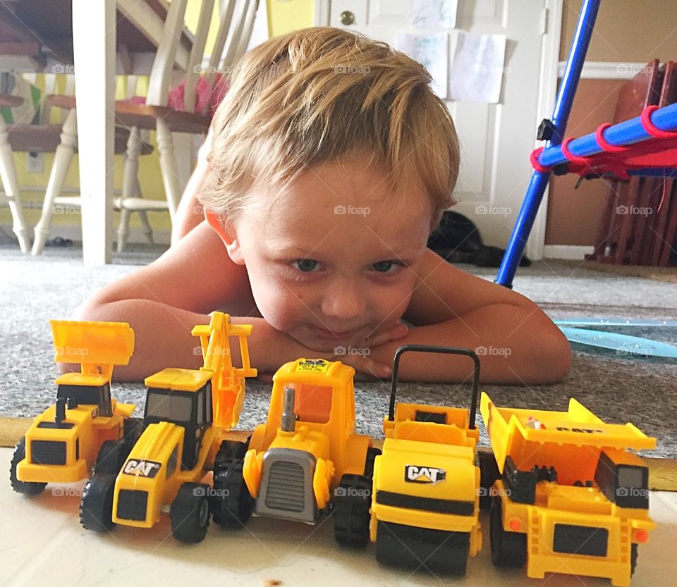 Small child with toys at home