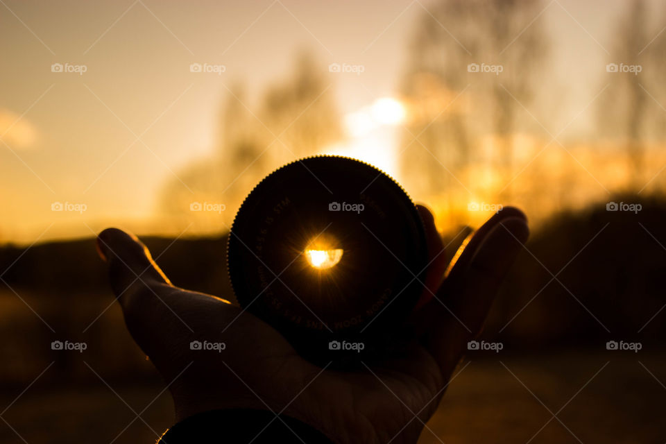 a canon lens in sunset