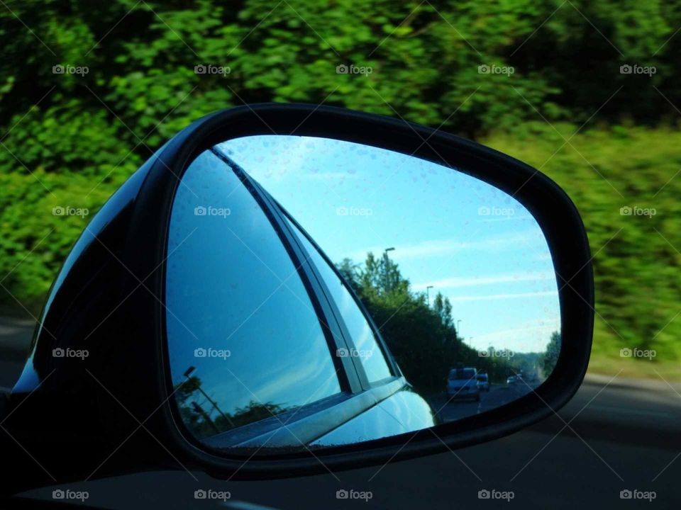 the view in the mirror driving by car