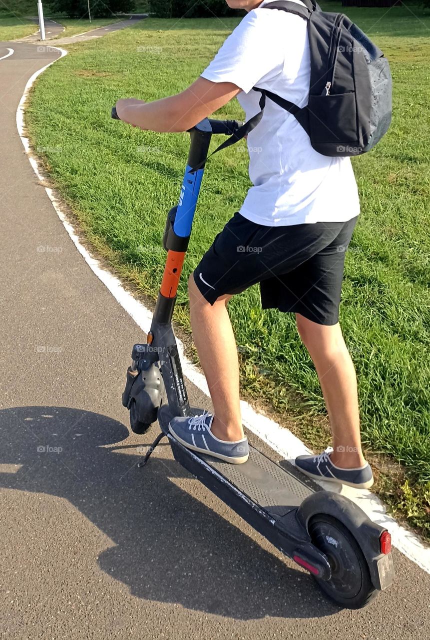 boy on a electric scooter, summer time