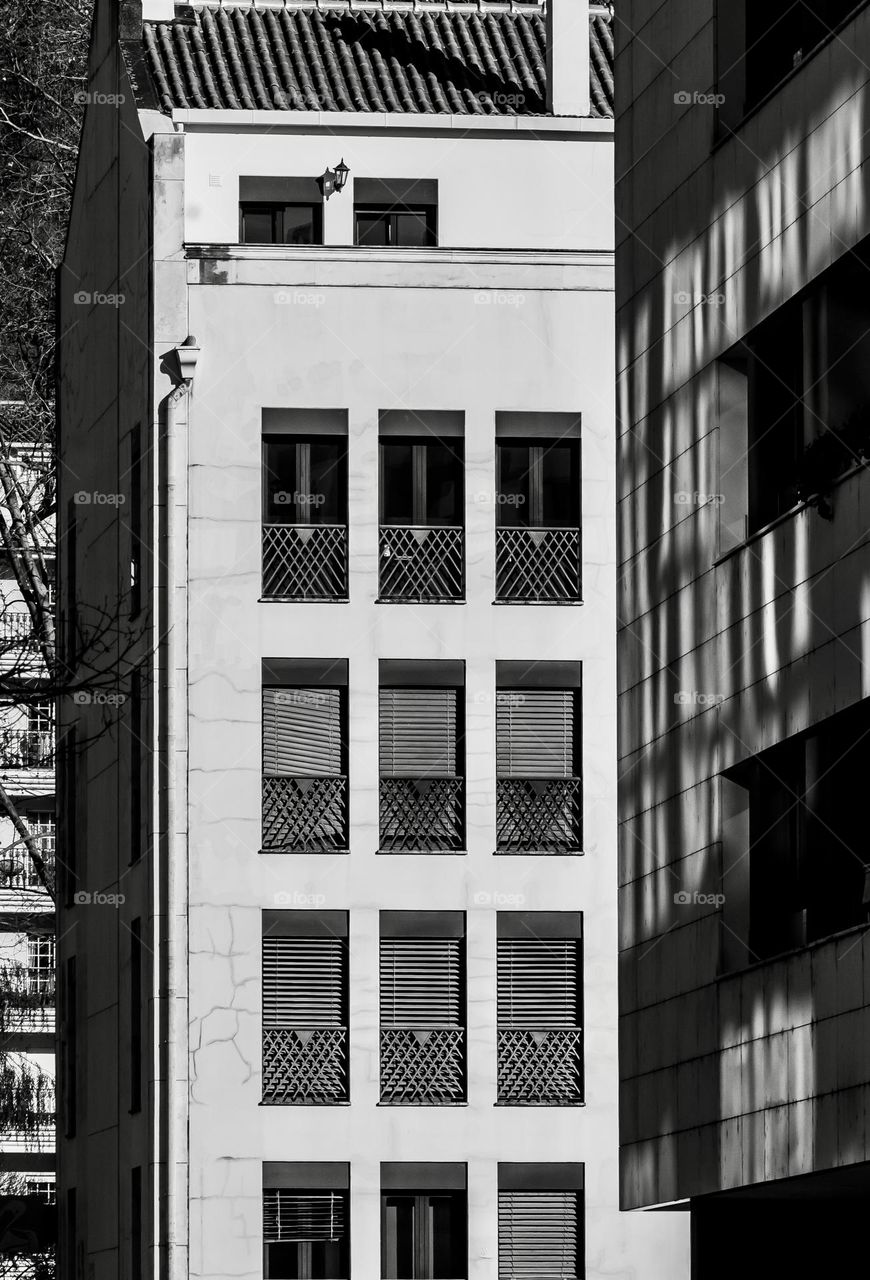 Apartment blocks with lots of windows and shadows 