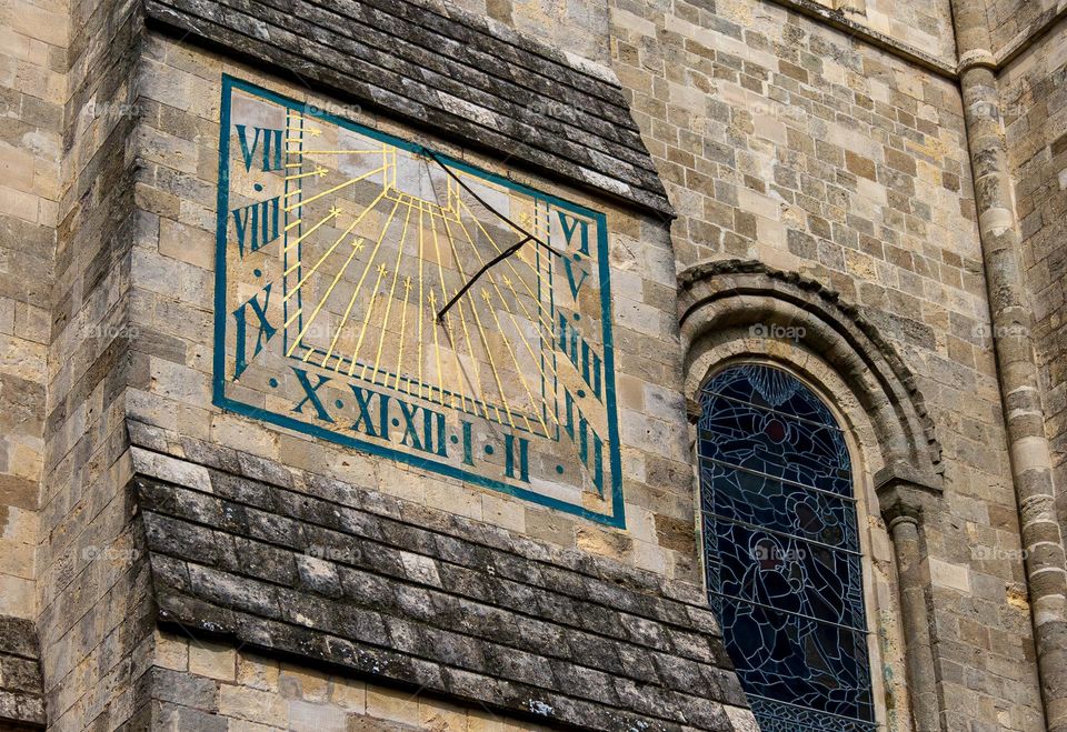 An 18th century sundial on an exterior wall of the median Chichester Cathedral, UK 