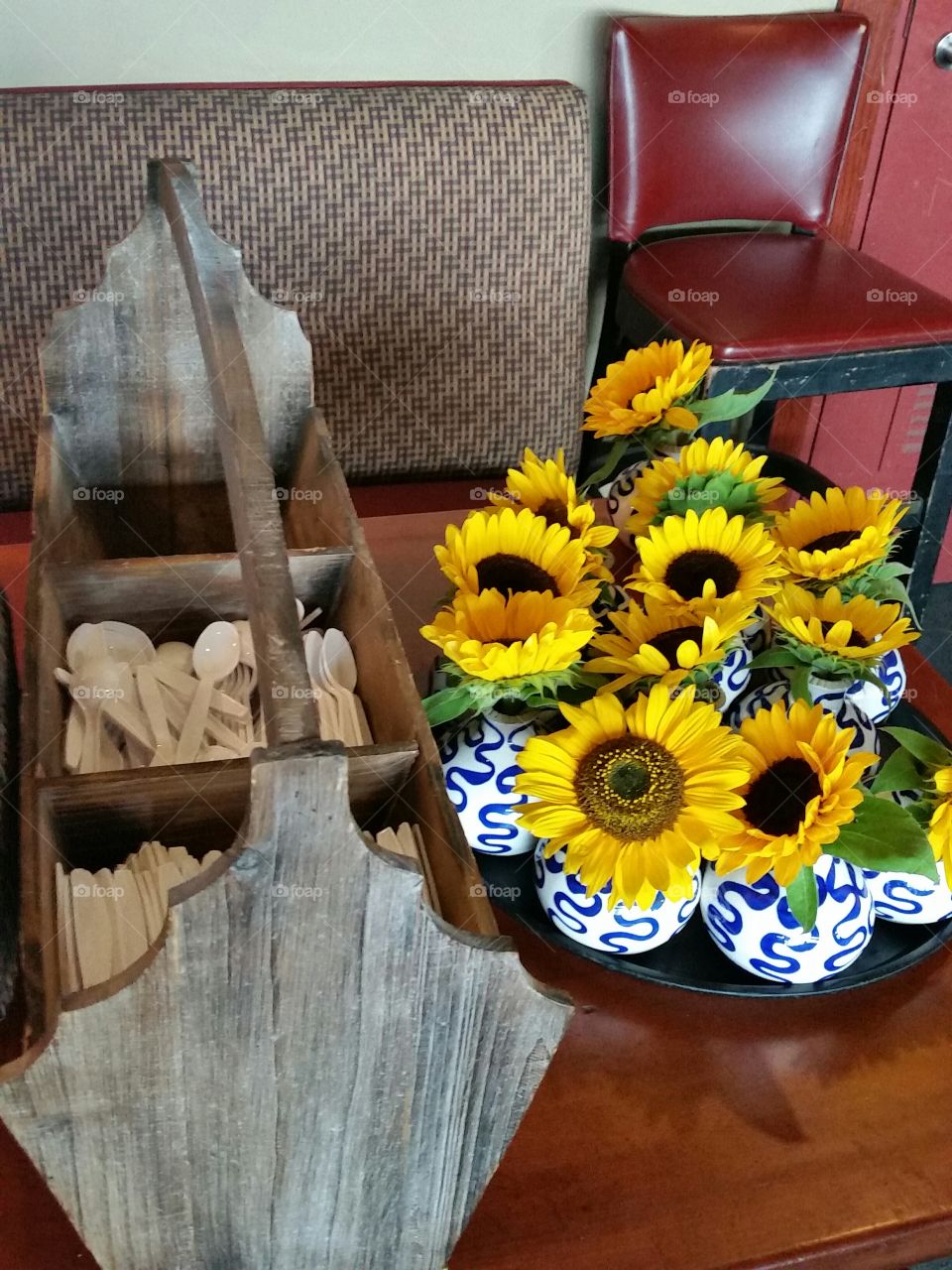 Yellow Sunflowers in vases. Flowers waiting to take their place on tables