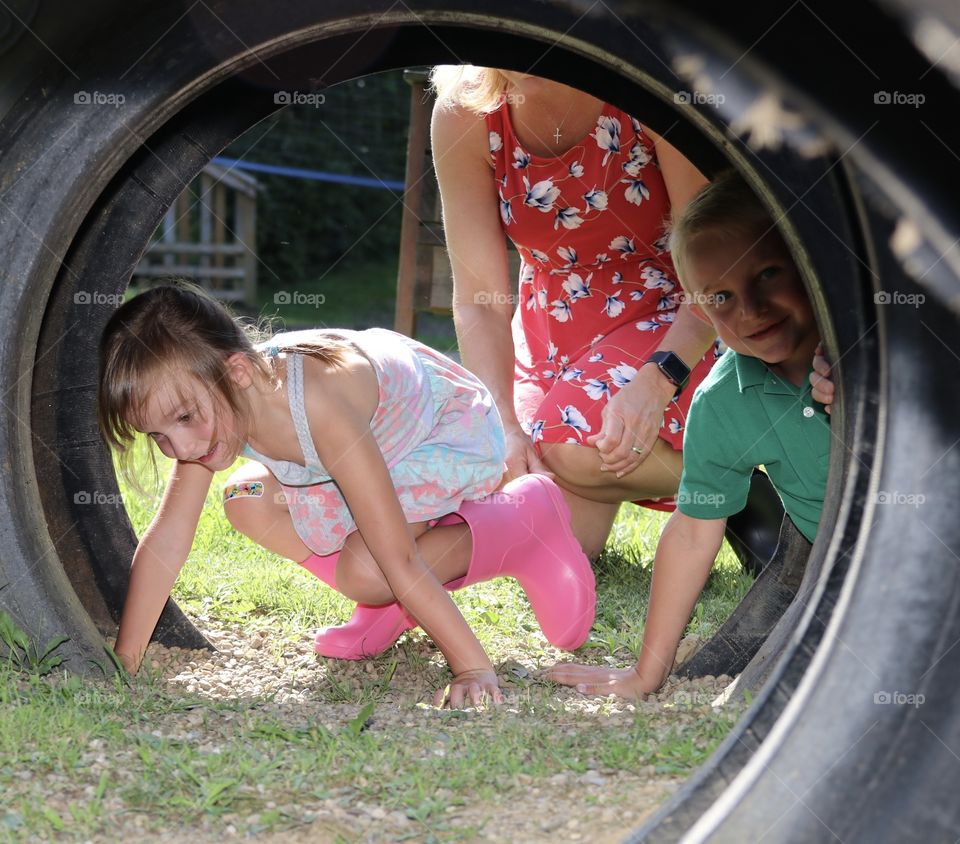 Mom playing with her children on a summer day 