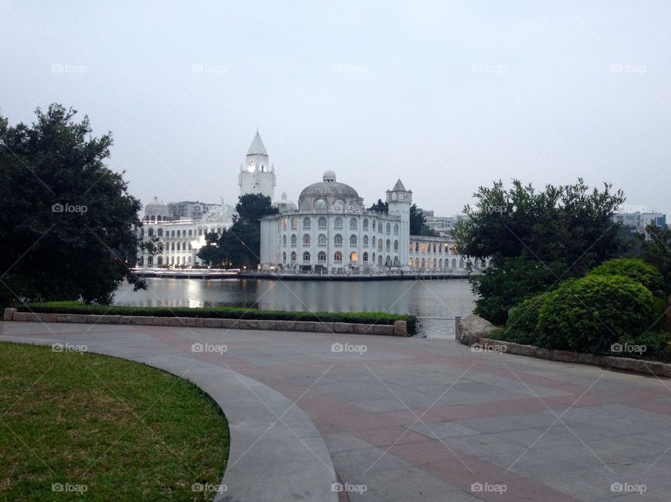 A palace on a lake in a park