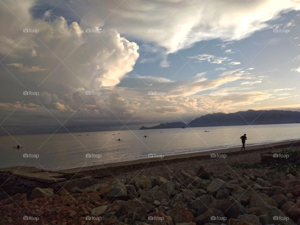 Jogging early morning by the sea. Díli, Timor-Leste