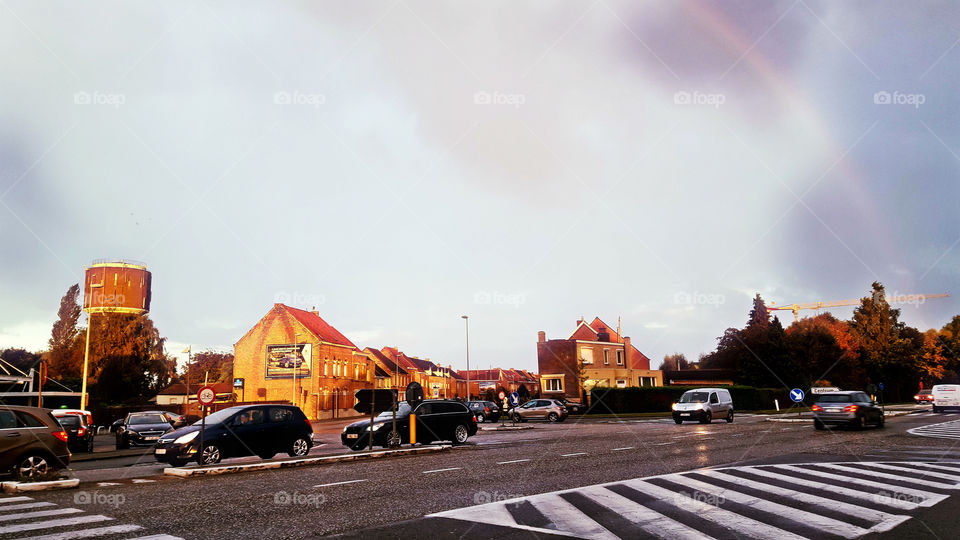 street panorama with water tower and rainbow