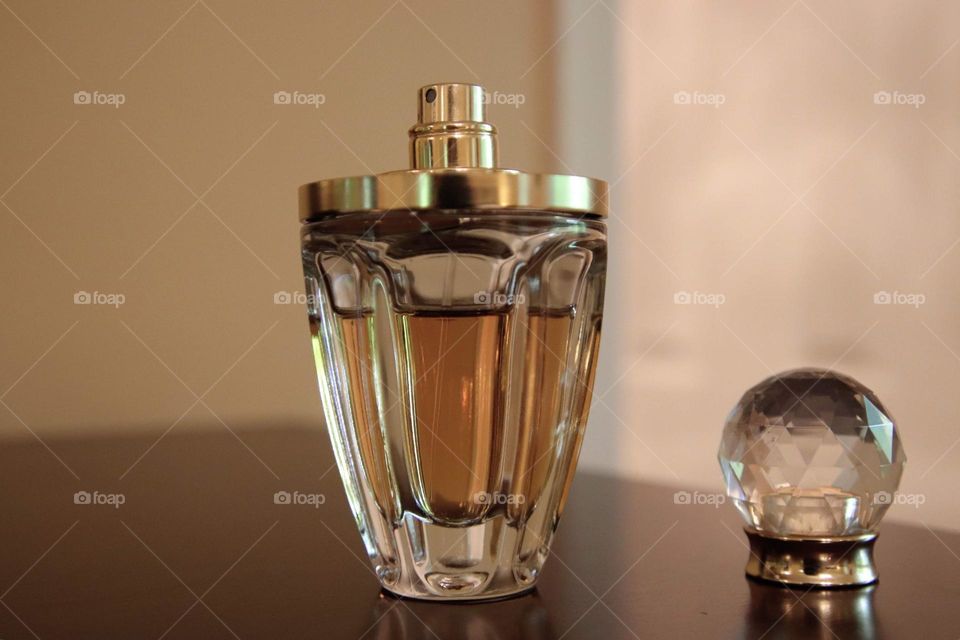 Perfume displayed on dresser