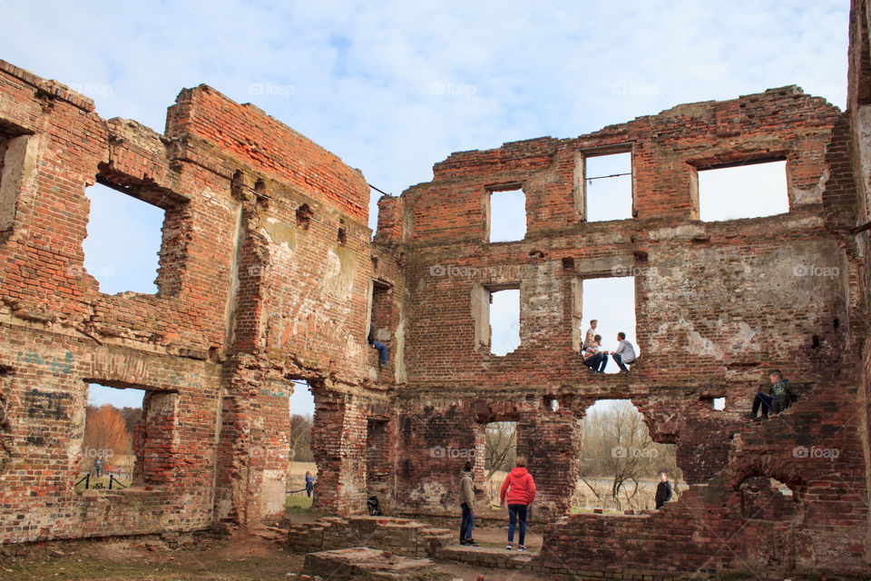 children play in the ruins of an old building