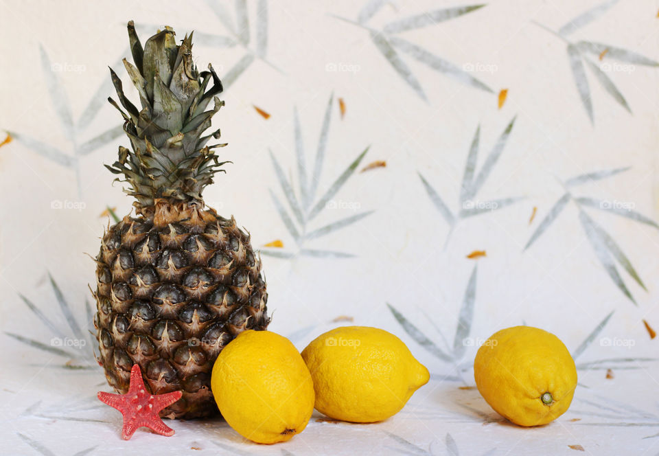 Summer fruits, lemons and pineapple