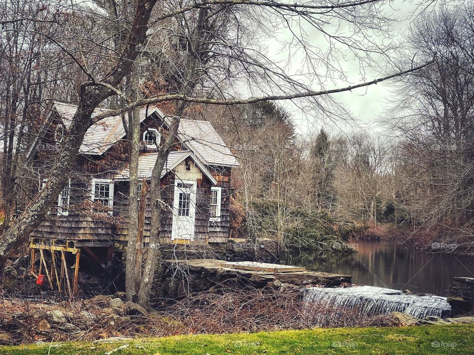 Building on stilts next to a waterfall in Connecticut 