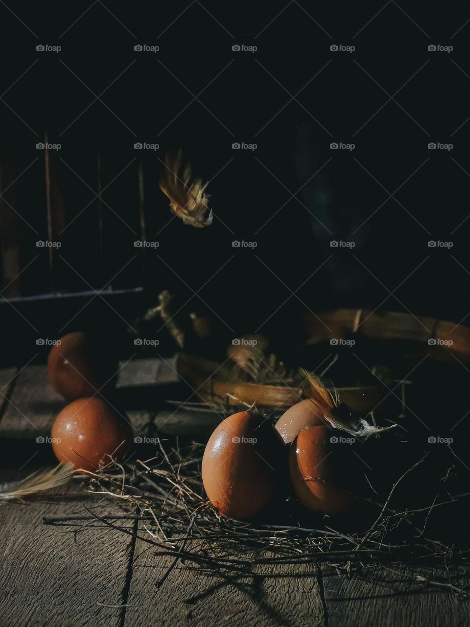 Fresh eggs on the wooden table with dark background.Still life concept photography.