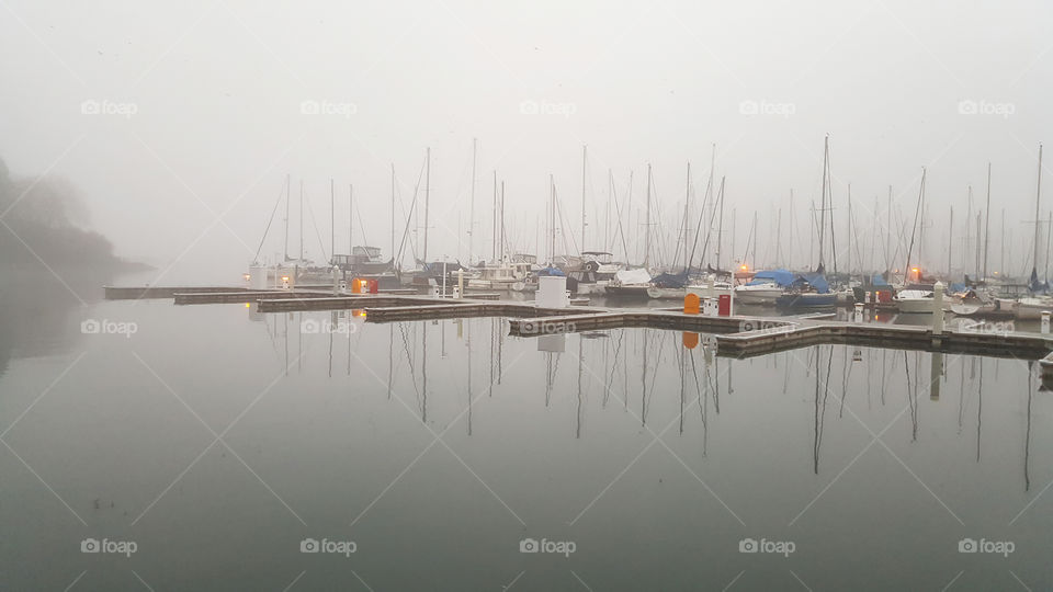 shades of greys with the morning mist along the sea wall