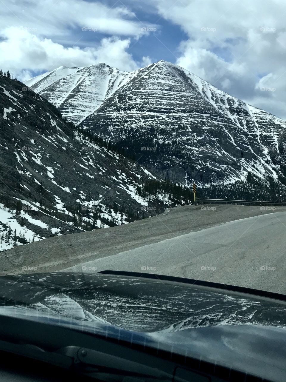 Spring drive on The Alaska Highway - Stone Mountain reflection on the hood