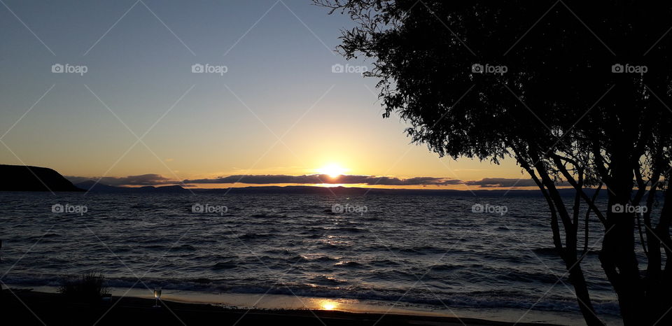 Sunsets at Lake Taupo, New Zealand. Reflective and stunning.