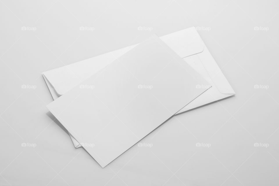 Blank white invitation card with an envelope