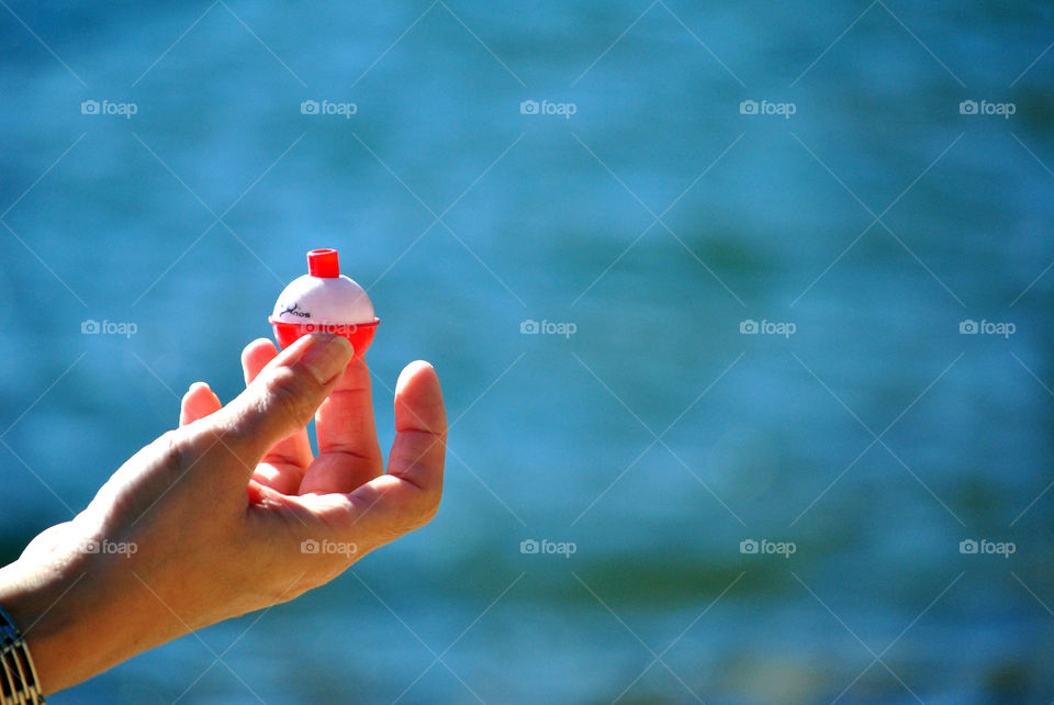 Macro shot, Fishing bobber, floater, hand, extreme, closeup