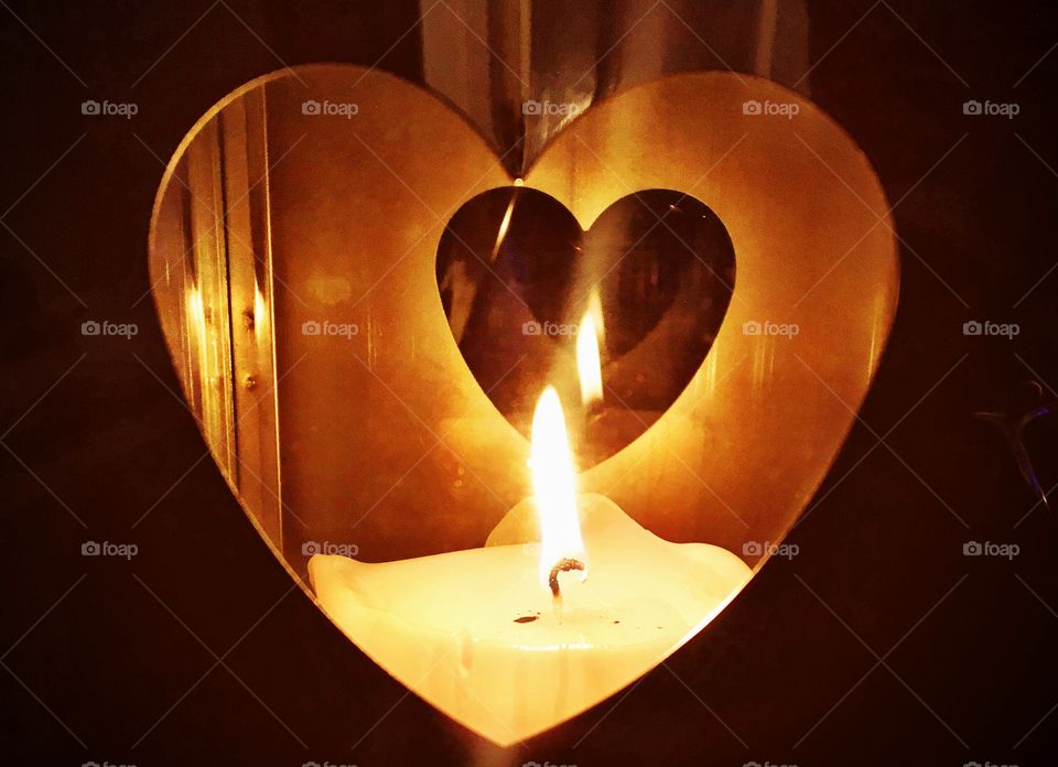 White candle burning in a lantern