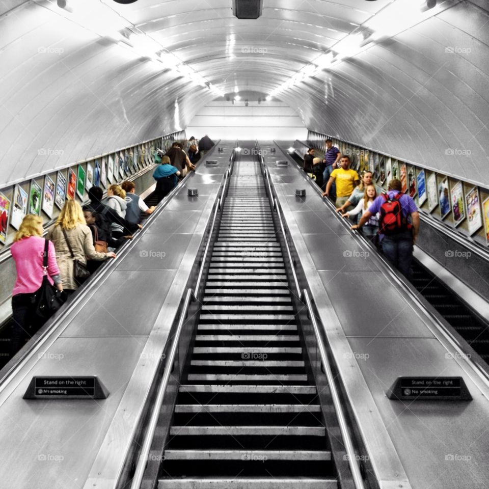 underground london station escalator by westatom. Colour Splash of passengers on the London Underground 