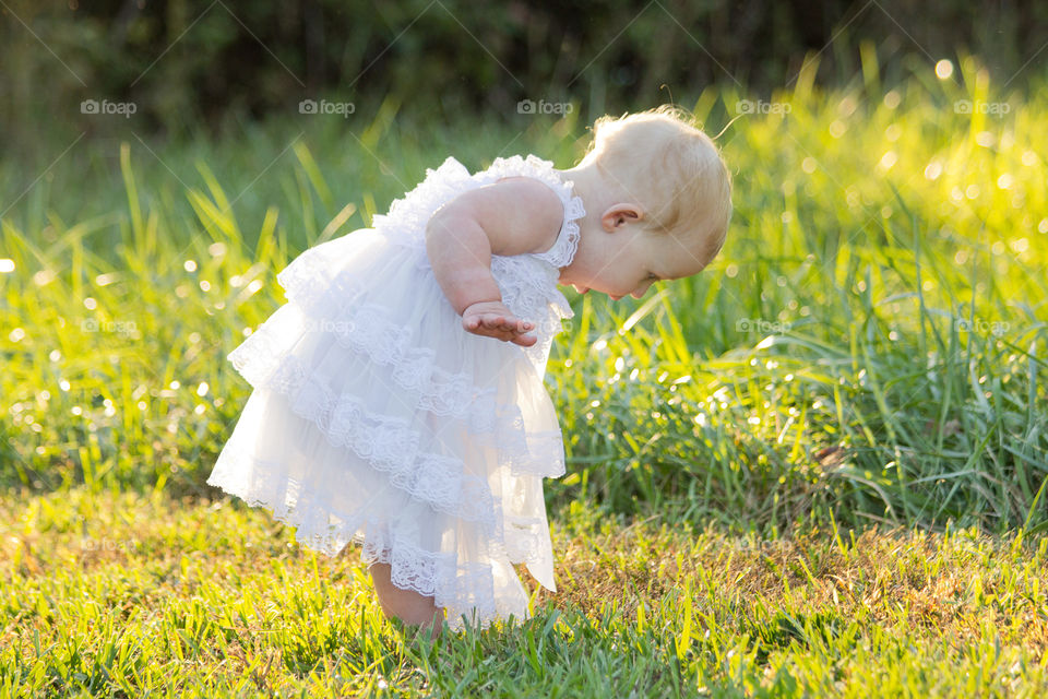 Girl standing in grass field