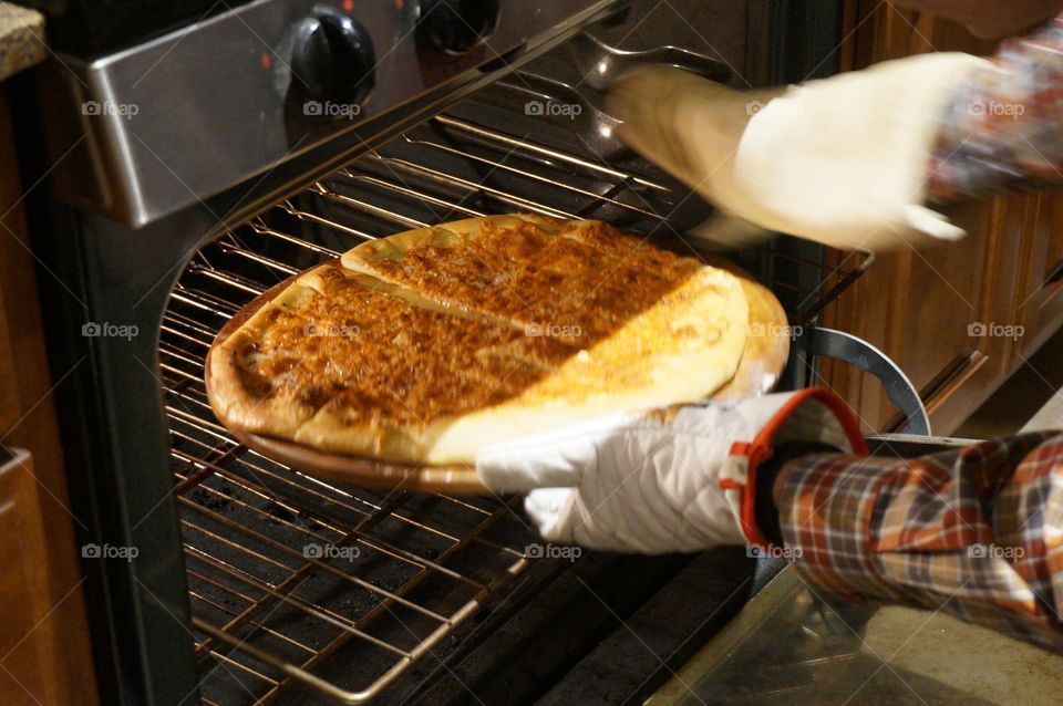 Cheesy bread coming out of the oven