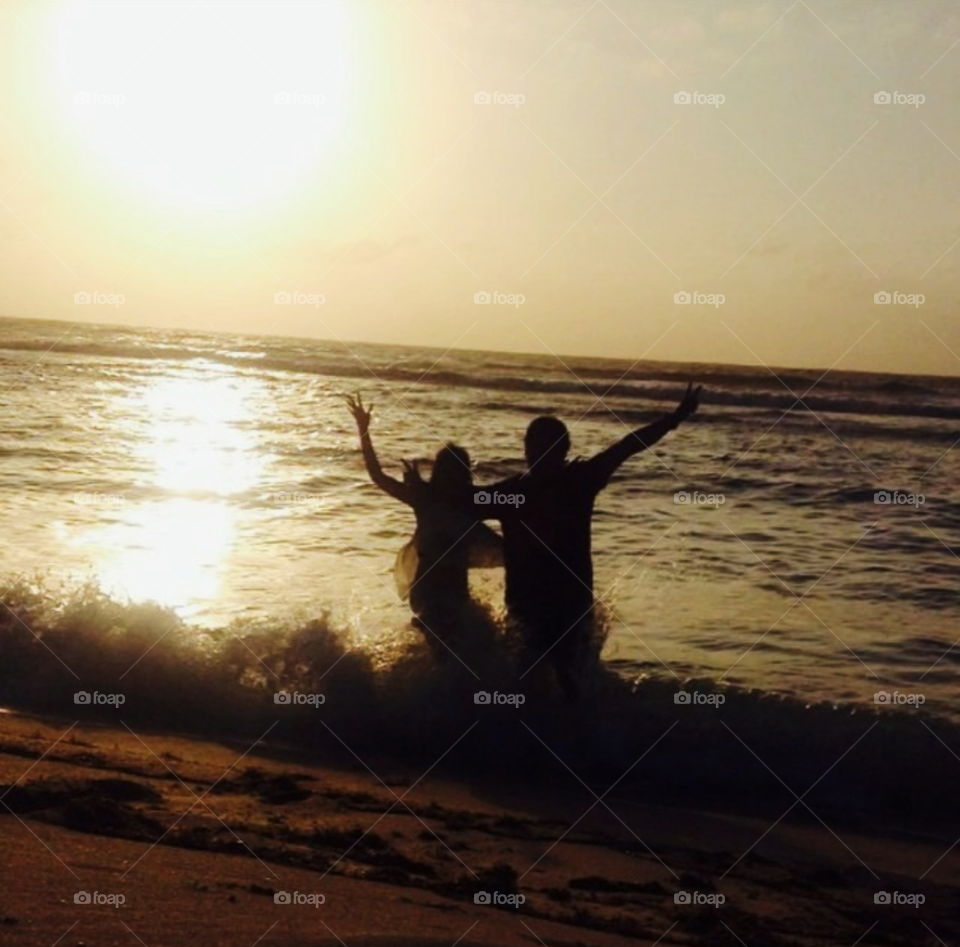 lovers playing in the sea shore