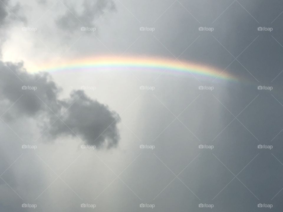 Rainbow in stormy sky