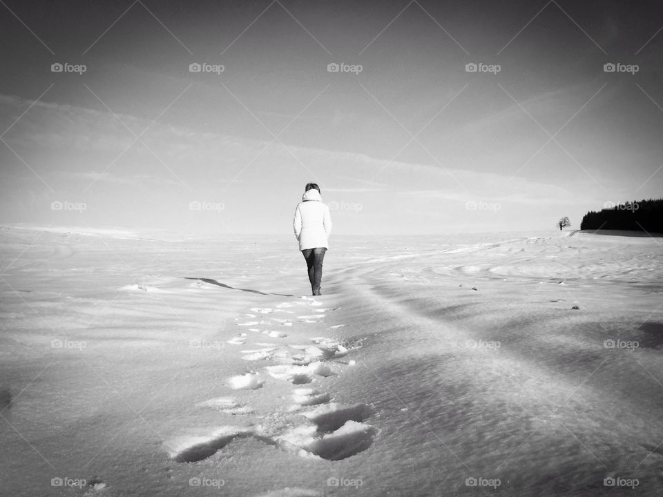 Woman walking on snow