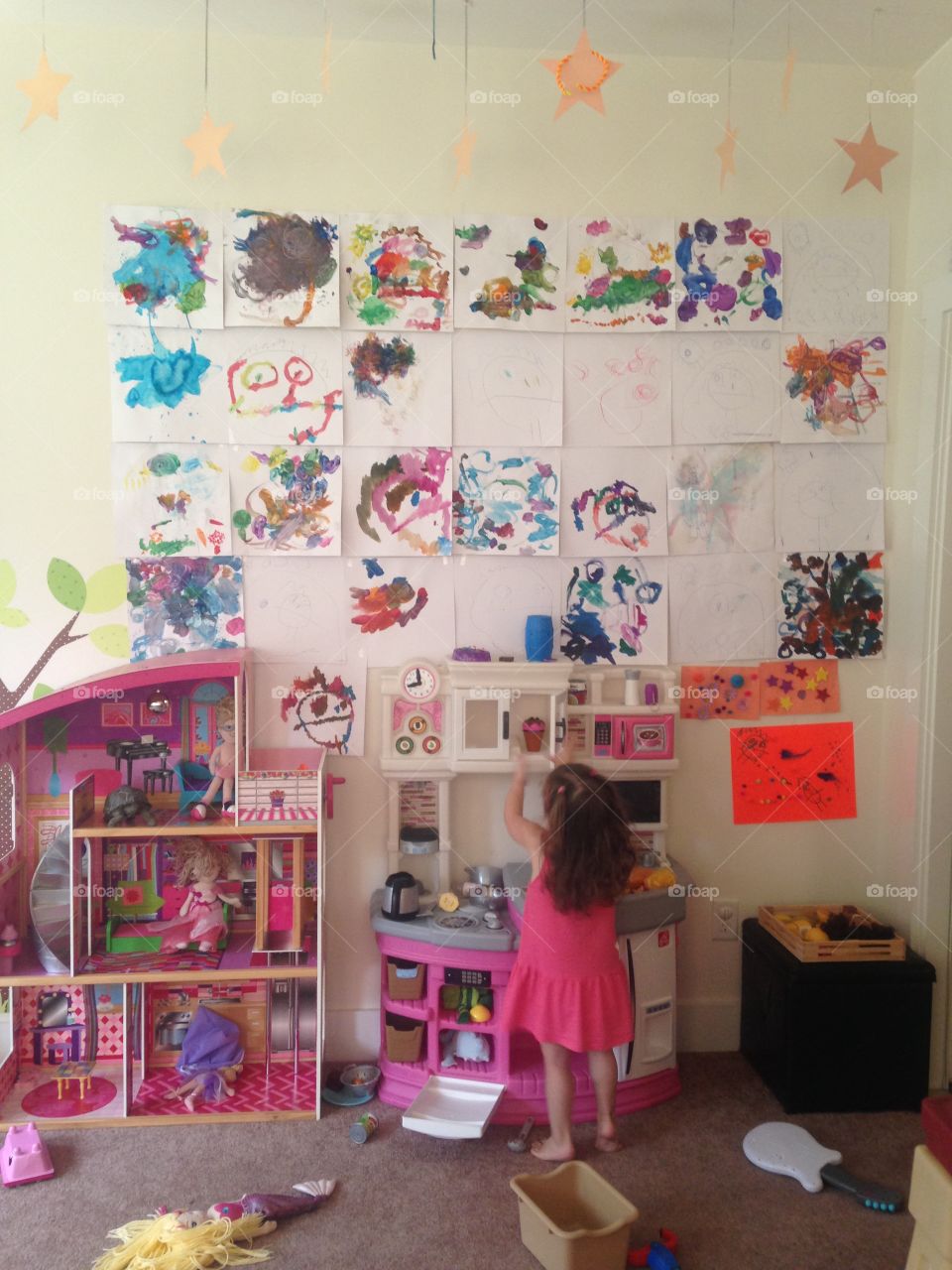 Playroom. My niece in her artwork-covered playroom.